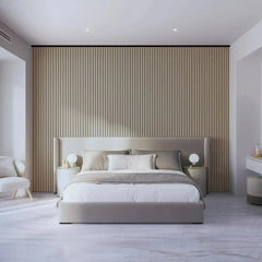 Modern bedroom with beige bed, round lamps, and slatted wood wall panels.